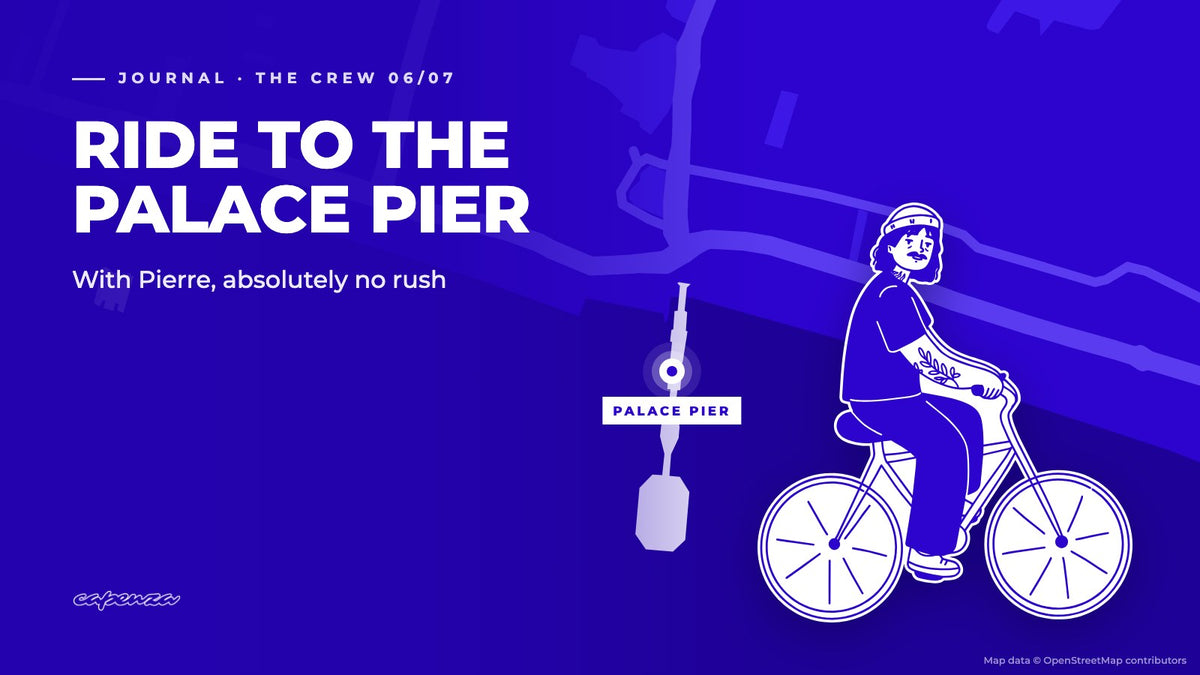 Pierre, the Capenza crew member, on his bike over a map of Brighton seafront and the Palace Pier