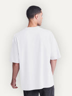 Essential Tee in Arctic White, worn by a model, back view