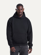 Essential Hoodie in Deep Black, worn by a model