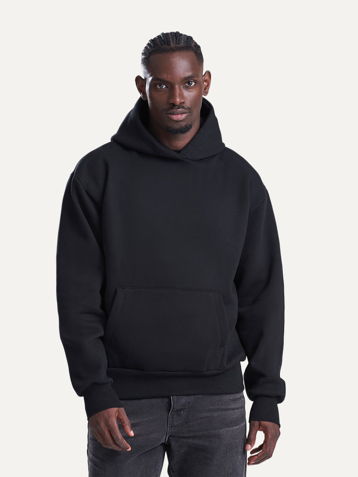 Essential Hoodie in Deep Black, worn by a model